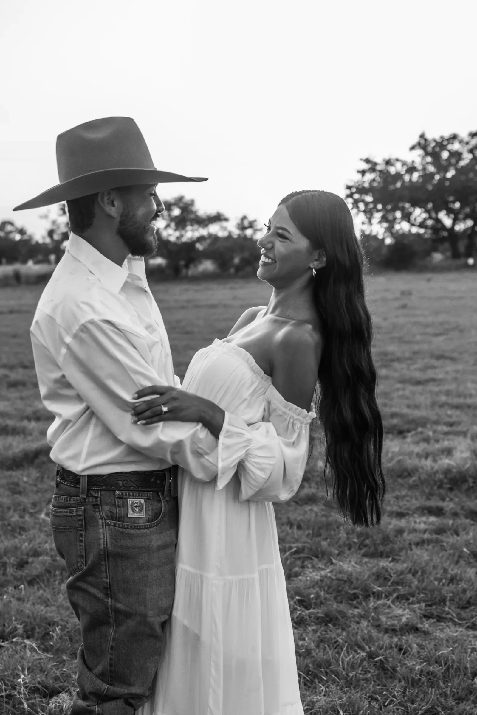 Wrapped up in each other in the tall grass as the evening light goes soft.