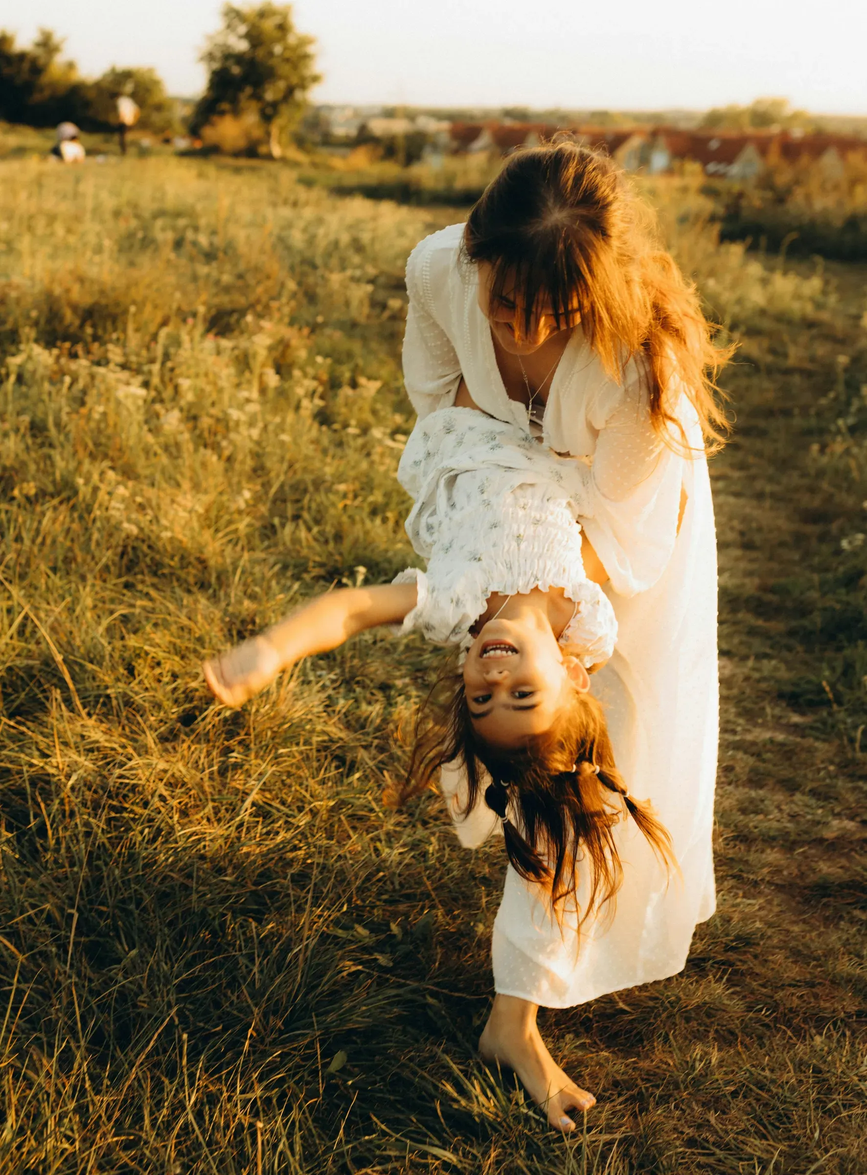 Mid-swing with hair flying, evening gold on everything.