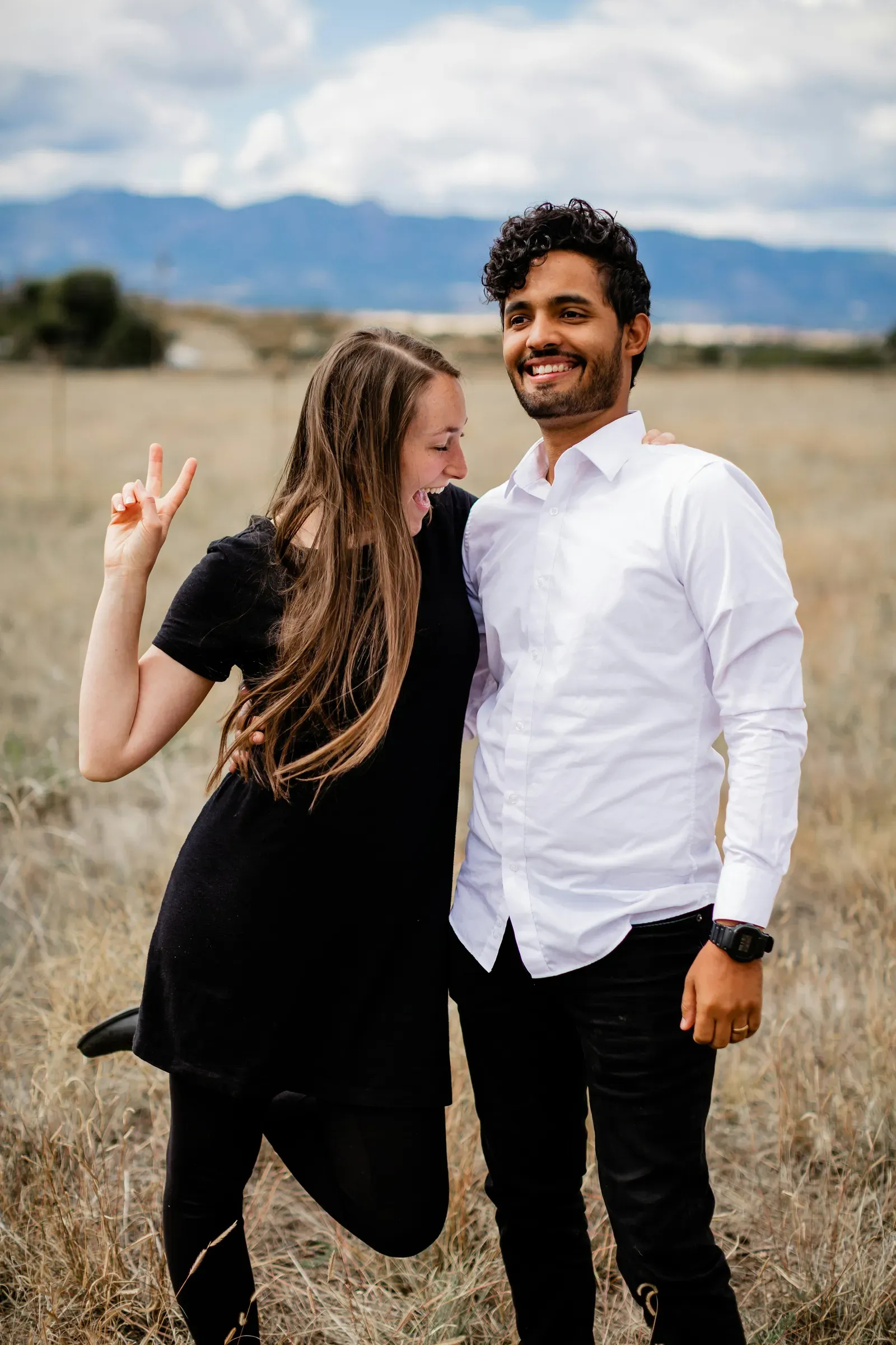She throws a peace sign while he grins — the outtake that made the cut.